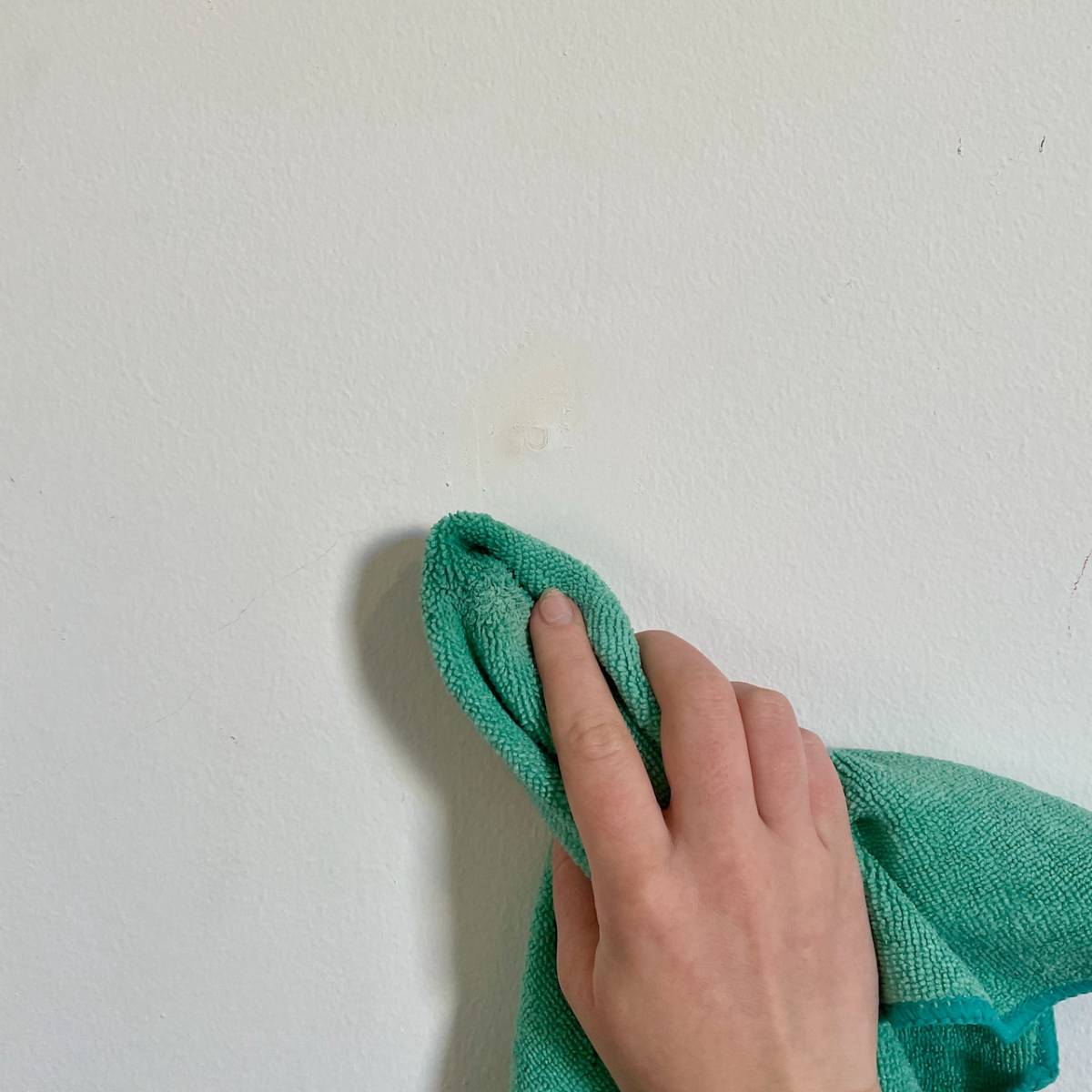 Leave to dry, then lightly sand the area again and wipe with a sponge